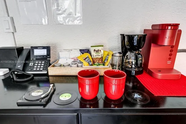 a kitchen with stainless steel appliances cabinets and a window