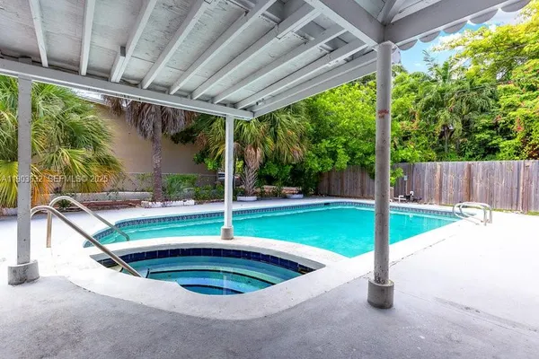 a room with furniture and screen flat screen tv