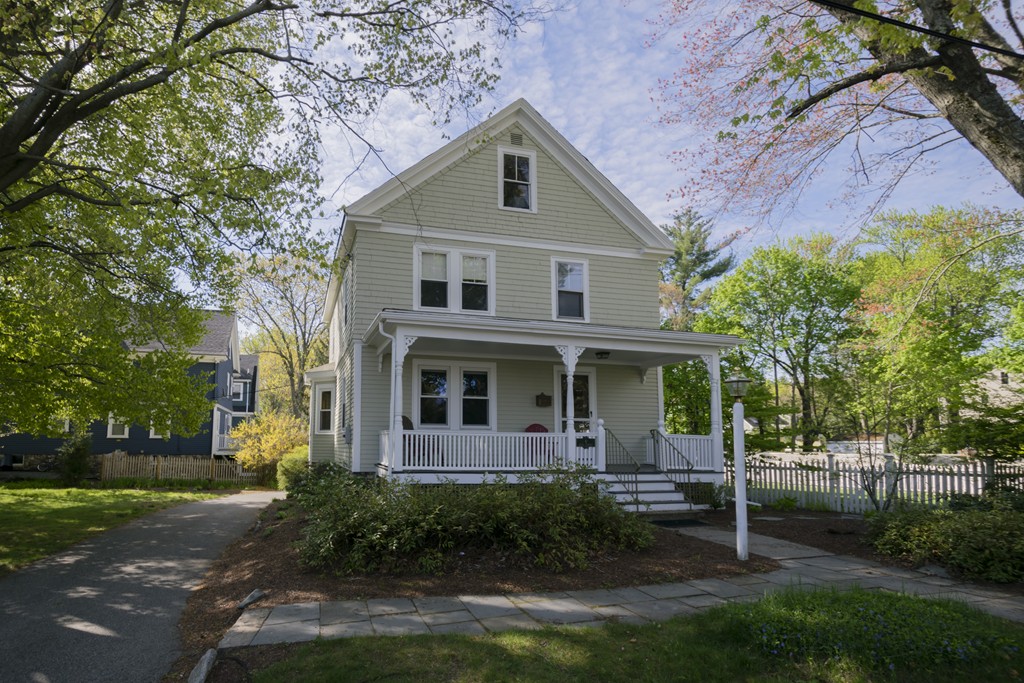 4 Reed Street Lexington, MA 02421 - Photo 1 of 30 a front view of a house with garden