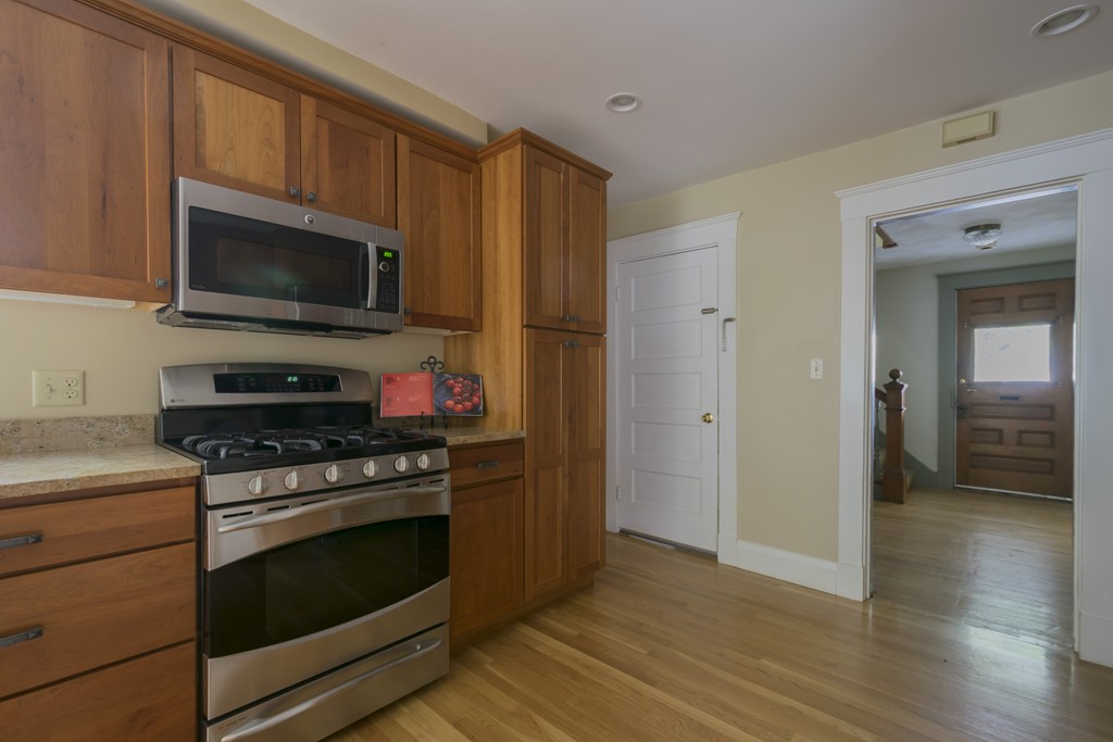 4 Reed Street Lexington, MA 02421 - Photo 13 of 30 a kitchen with a stove and a microwave