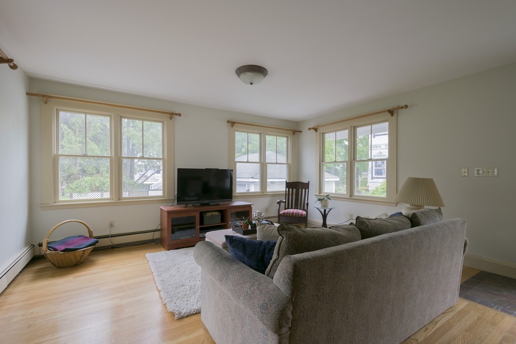 4 Reed Street Lexington, MA 02421 - Photo 15 of 30 a living room with furniture and a flat screen tv