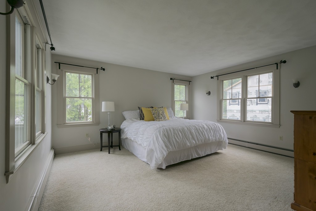 4 Reed Street Lexington, MA 02421 - Photo 20 of 30 a bedroom with a bed and a window
