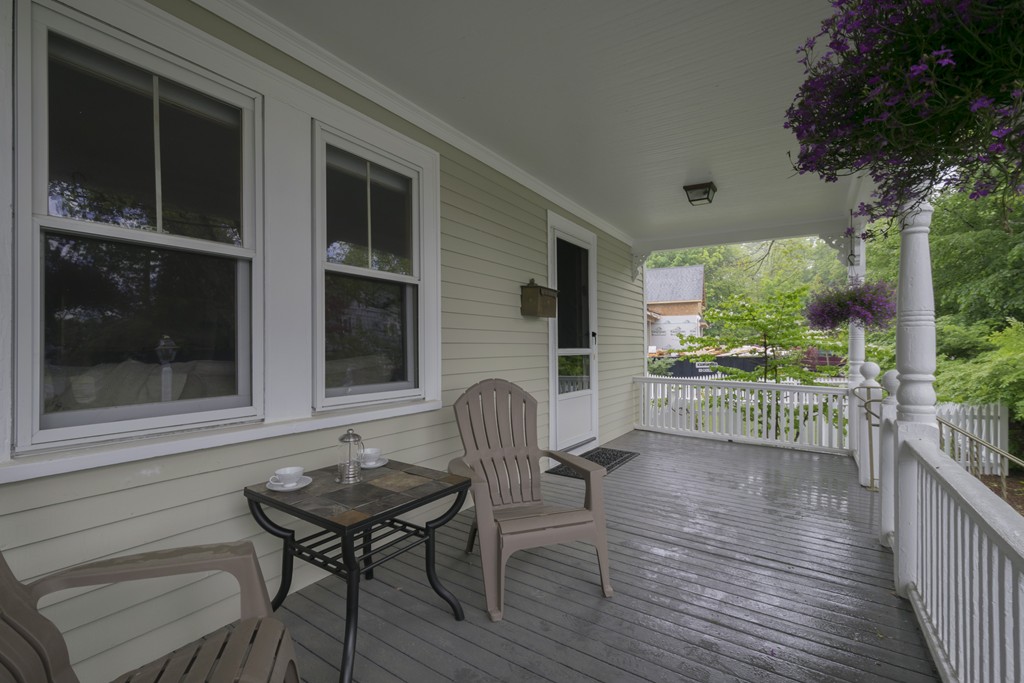 4 Reed Street Lexington, MA 02421 - Photo 2 of 30 a backyard of a house with wooden floor table and chairs