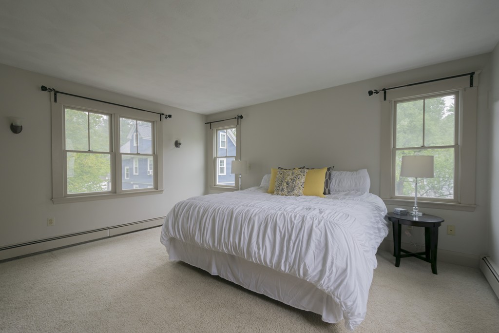 4 Reed Street Lexington, MA 02421 - Photo 21 of 30 a bedroom with a bed and a window