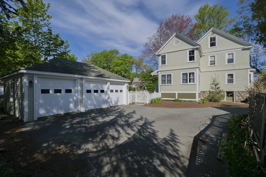 4 Reed Street Lexington, MA 02421 - Photo 30 of 30 a front view of a house with a garden