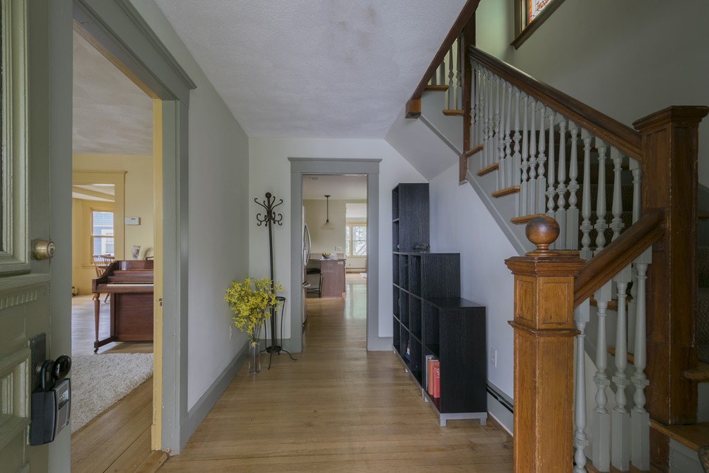 4 Reed Street Lexington, MA 02421 - Photo 3 of 30 a view of hallway with wooden floor and stairs
