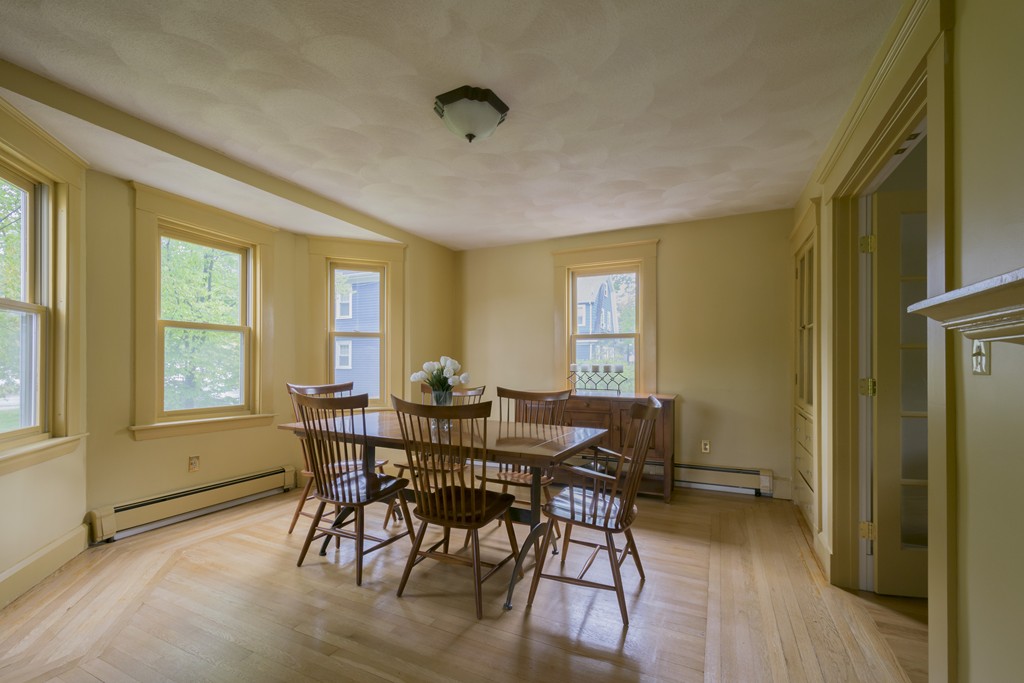 4 Reed Street Lexington, MA 02421 - Photo 6 of 30 a view of a dining room with furniture and wooden floor