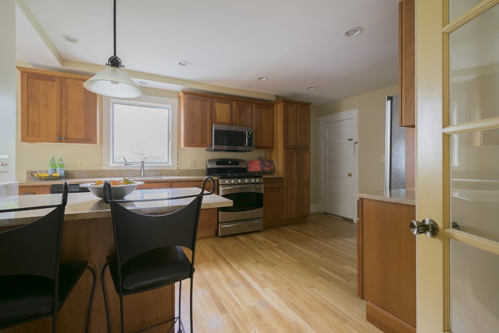 4 Reed Street Lexington, MA 02421 - Photo 10 of 30 a kitchen with a sink appliances and cabinets