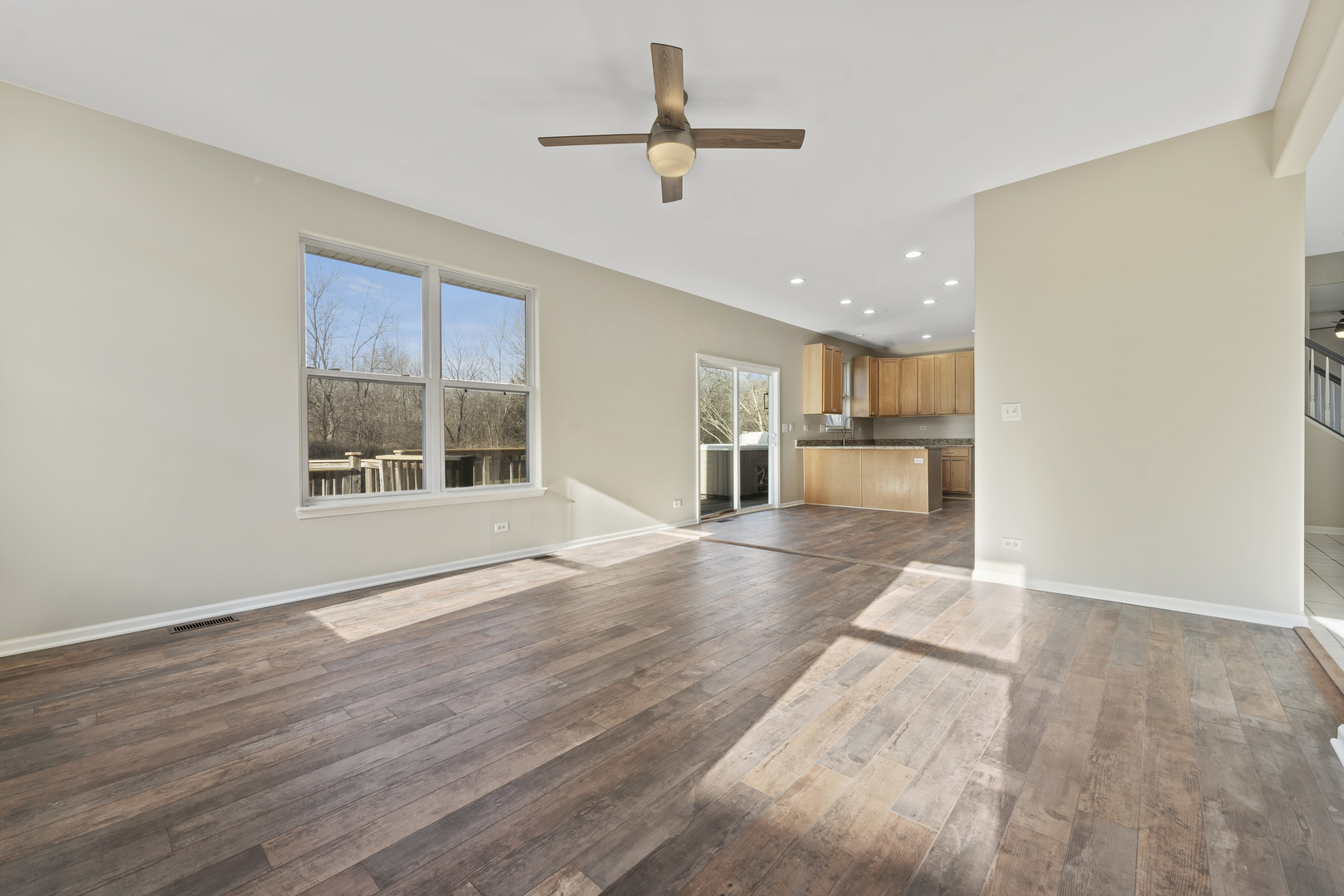 32804 Bending Creek Road Lakemoor, IL 60051 - Photo 16 of 42 a view of a electric room wooden floor a ceiling fan and windows