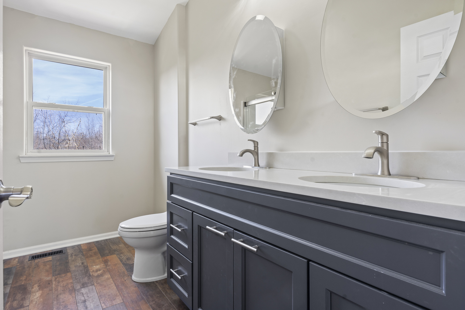 32804 Bending Creek Road Lakemoor, IL 60051 - Photo 22 of 42 a bathroom with a toilet sink and mirror