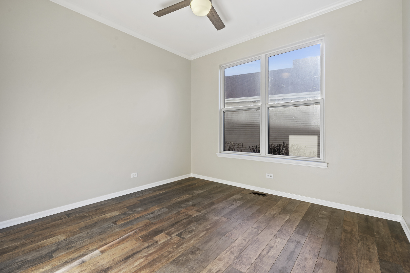 32804 Bending Creek Road Lakemoor, IL 60051 - Photo 25 of 42 an empty room with wooden floor and windows