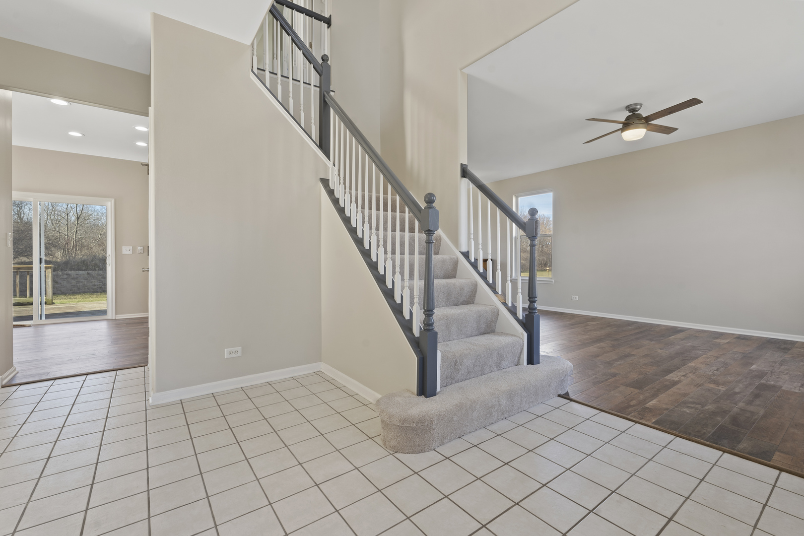 32804 Bending Creek Road Lakemoor, IL 60051 - Photo 3 of 42 a view of an entryway with staircase