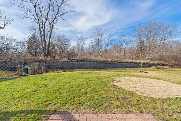 a view of a swimming pool with an outdoor space and seating area