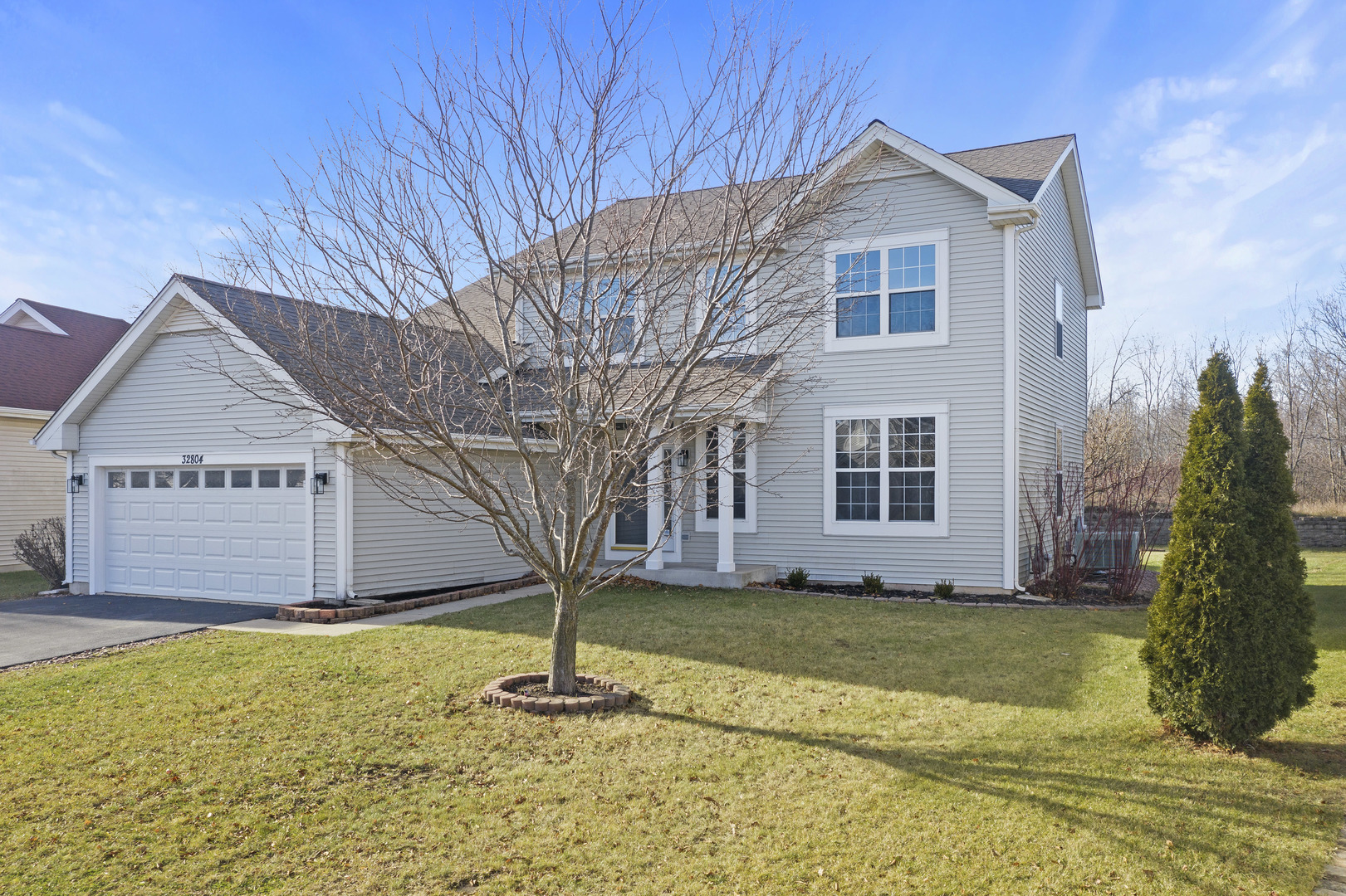 32804 Bending Creek Road Lakemoor, IL 60051 - Photo 42 of 42 a front view of a house with a yard