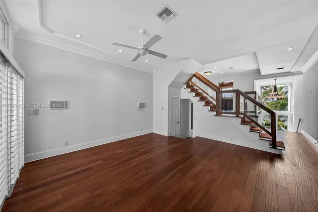 a bed room with two bed and a chandelier