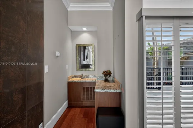 a large bedroom with a bed and a television in it