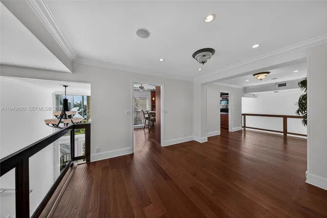 a bathroom with a granite countertop bathtub a sink and a window