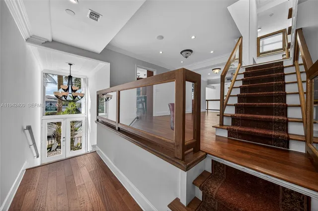 a bathroom with a granite countertop sink a toilet a mirror and shower
