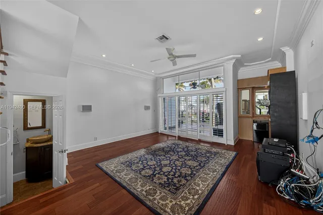 a bathroom with a granite countertop sink a mirror and window