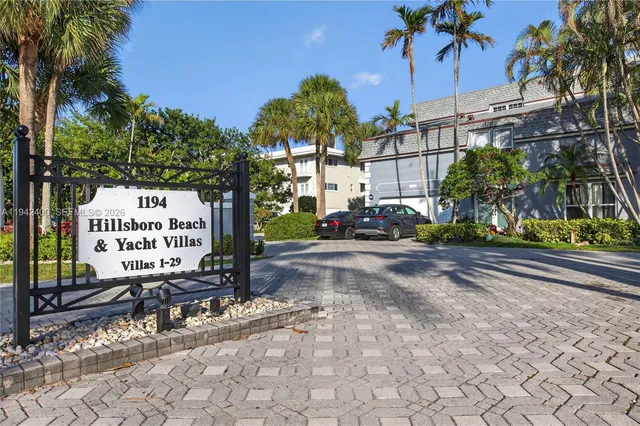 a view of a room with wooden floor and stairs