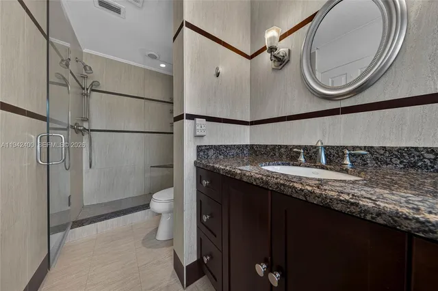 a livingroom with workspace and a flat screen tv