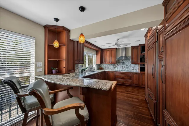 a view of a hallway with a dining room