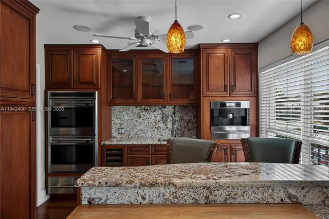 a spacious bedroom with a bed and a flat screen tv