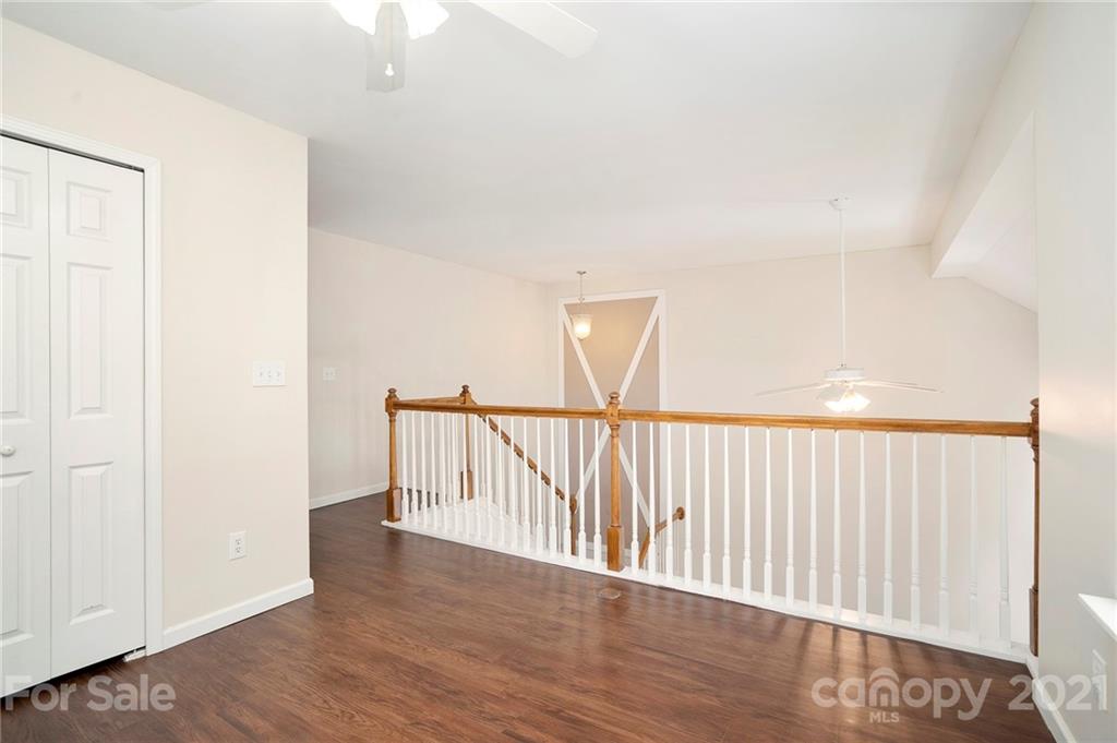 10621 Fuller Ridge Circle Charlotte, NC 28270 - Photo 16 of 32 a view of staircase with wooden floor
