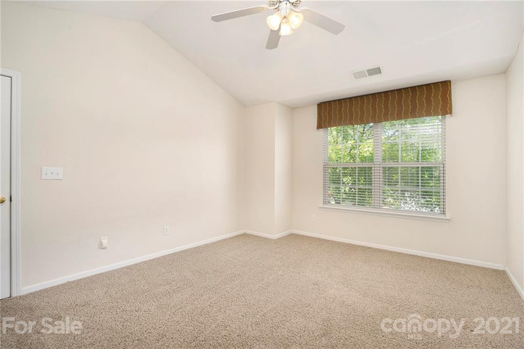 10621 Fuller Ridge Circle Charlotte, NC 28270 - Photo 23 of 32 an empty room with a window