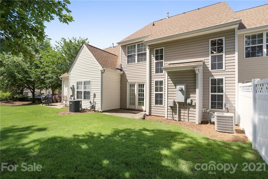 10621 Fuller Ridge Circle Charlotte, NC 28270 - Photo 30 of 32 a view of a house with a yard and sitting area