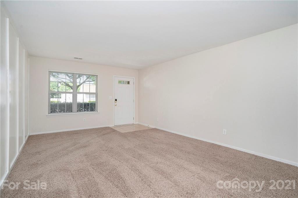 10621 Fuller Ridge Circle Charlotte, NC 28270 - Photo 9 of 32 an empty room with windows