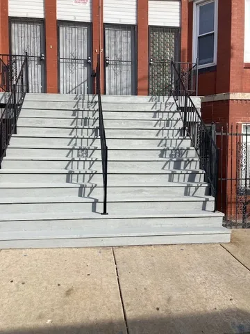 a view of a balcony with stairs