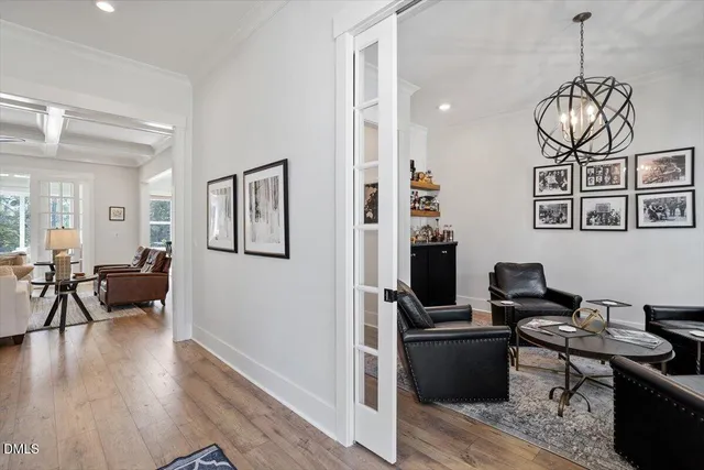a view of a livingroom with workspace and a window