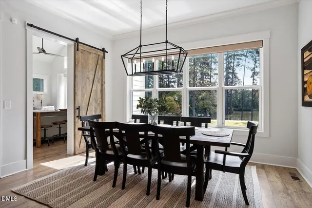 a view of a dining room with furniture window and outside view