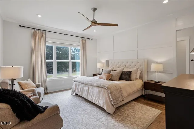 a bedroom with a bed couch and window