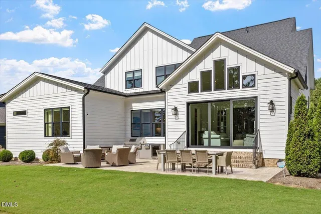 a view of house with a yard