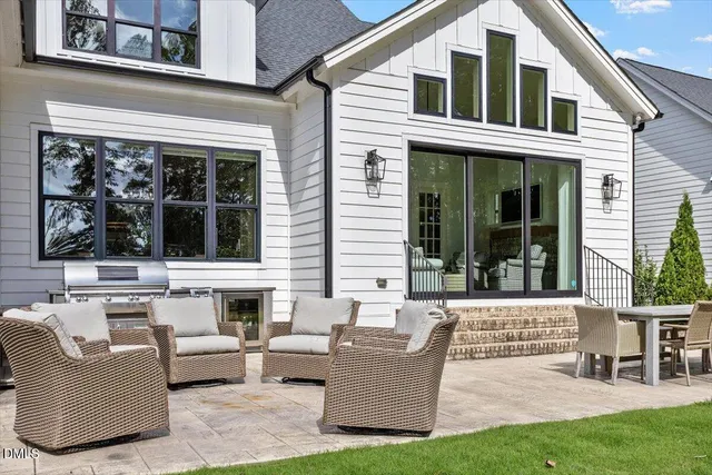 a view of a house and a couches in front of house