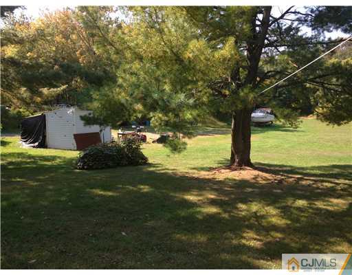 210 Morganville Road Old Bridge, NJ 07747 - Photo 8 of 8 a backyard of a house with lots of green space