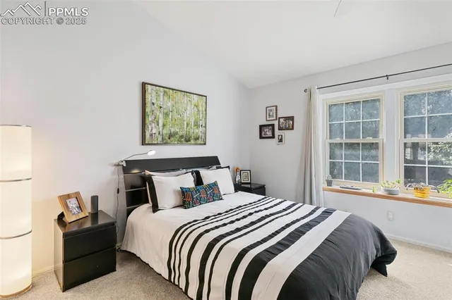 a bedroom with bed and window