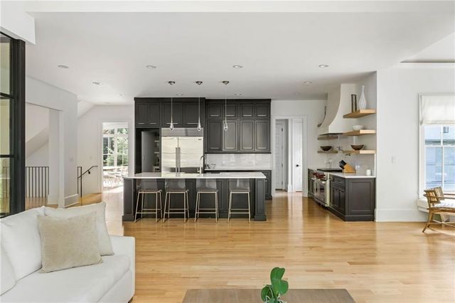 a spacious bedroom with a bed and window