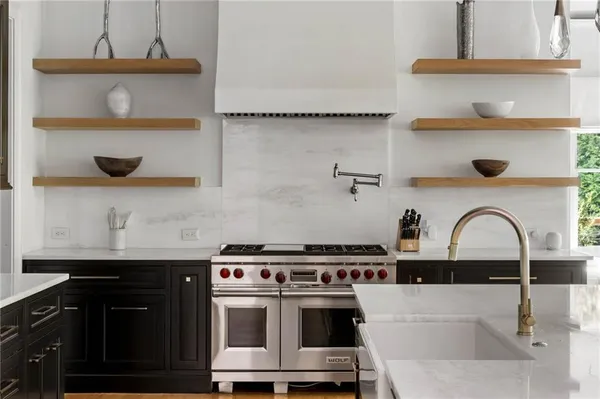 a spacious bathroom with a granite countertop sink mirror and a