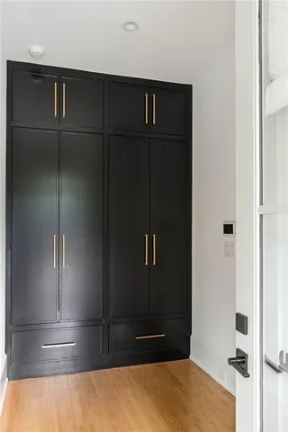 a bathroom with a granite countertop sink toilet a mirror and shower