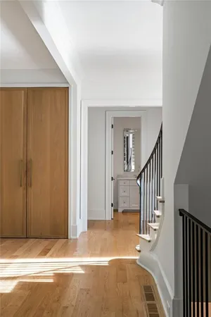 a large white house with a white door in front of it