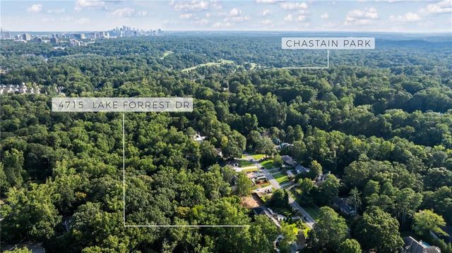 a kitchen with a stove a refrigerator and a fireplace with wooden floor