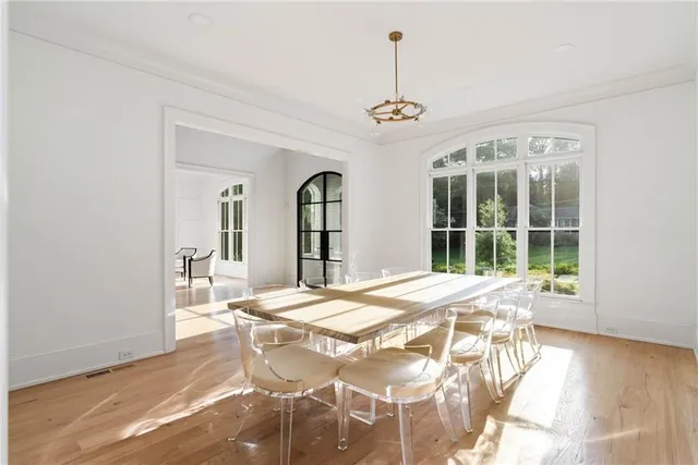 a bathroom with a granite countertop double vanity sink and mirror