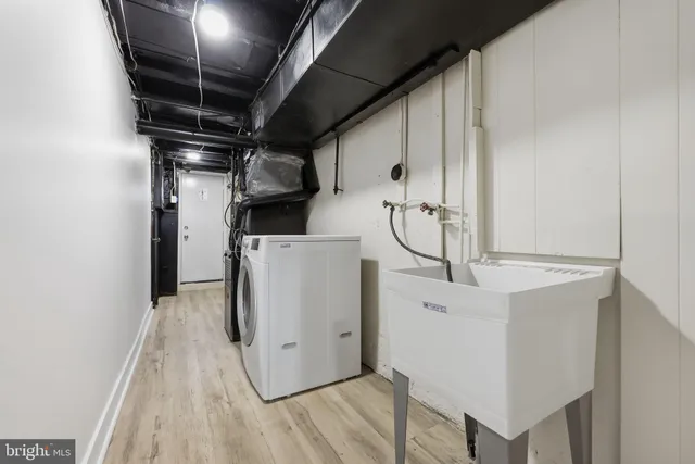 a view of a storage & utility room with washer and dryer