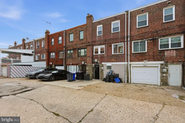a view of a brick building with many windows