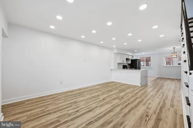 a view of kitchen with wooden floor