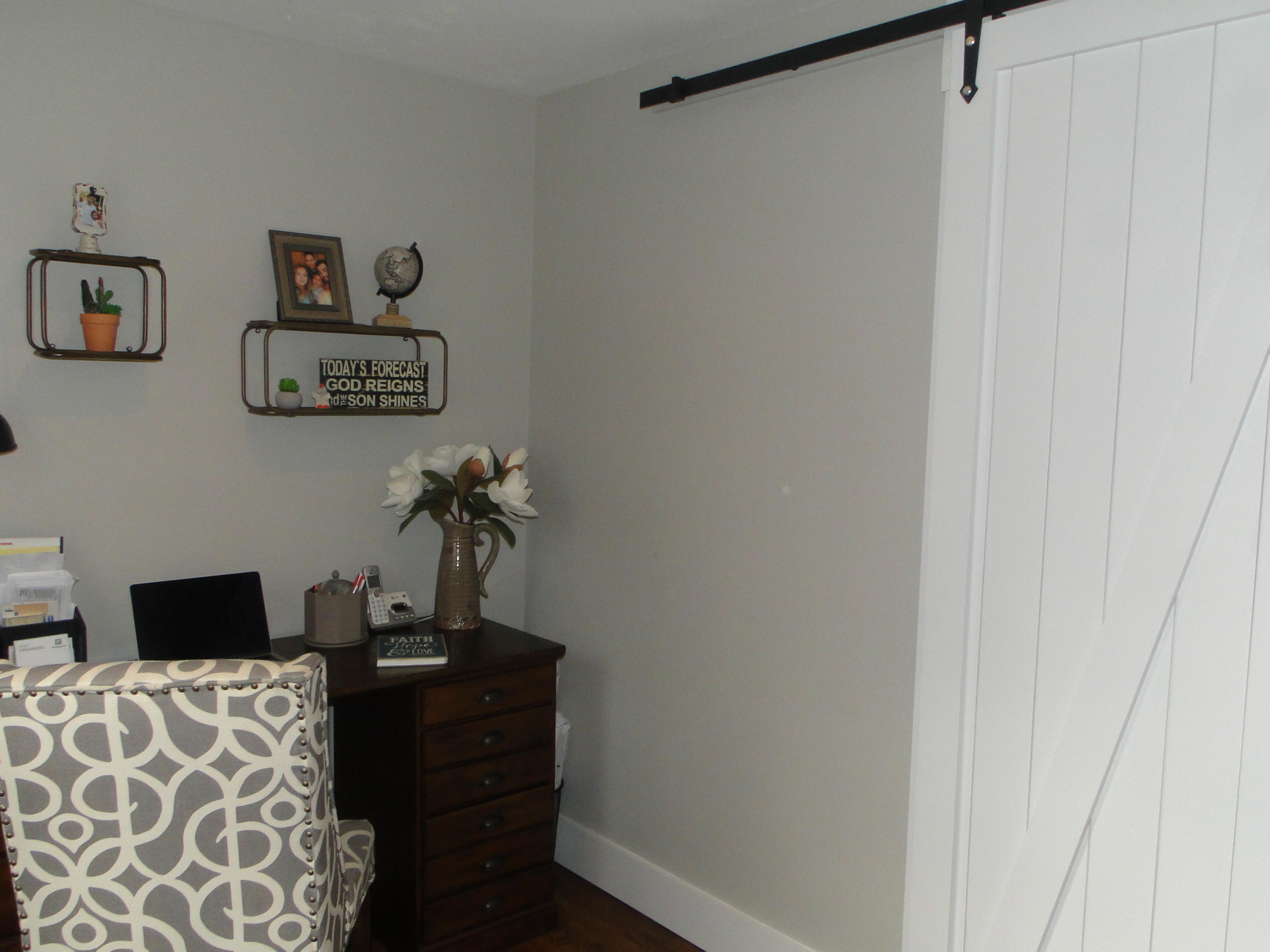 30 Brewster Road Mashpee, MA 02649 - Photo 11 of 58 a desk with chair and paintings on the wall
