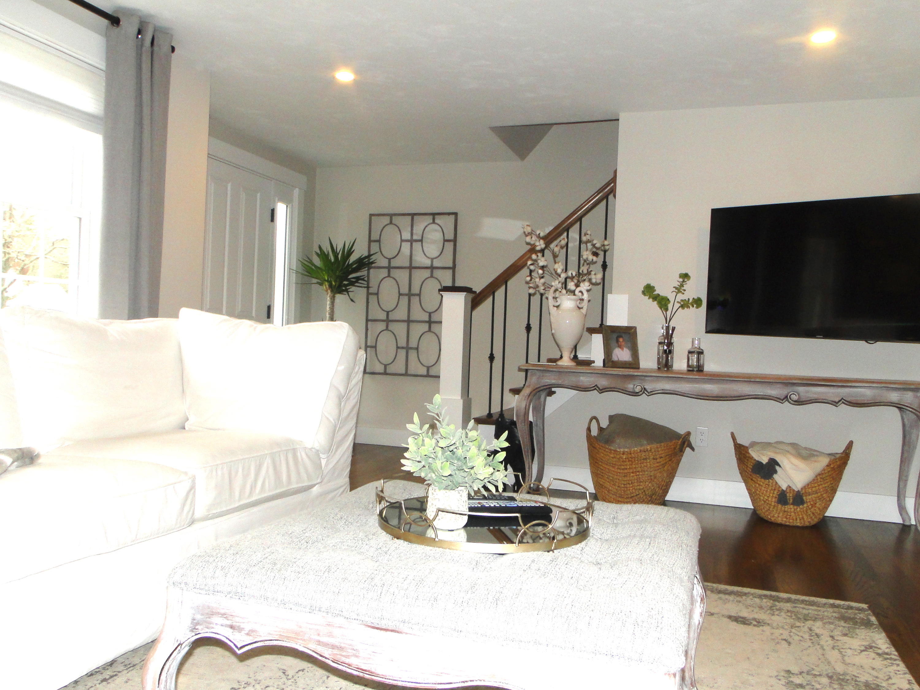 30 Brewster Road Mashpee, MA 02649 - Photo 15 of 58 a living room with furniture and a flat screen tv